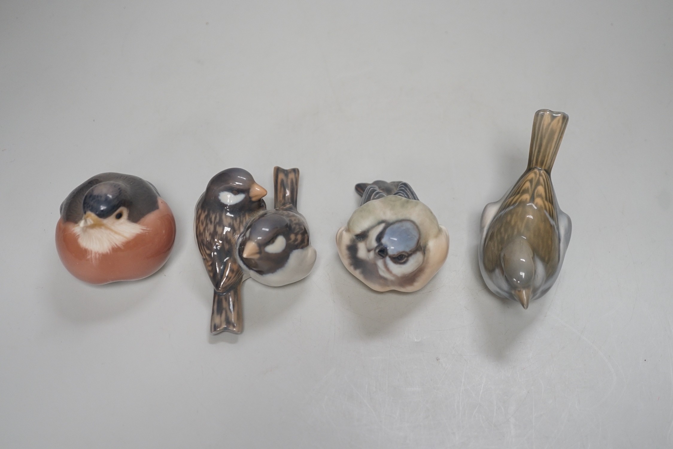 Four Copenhagen models of birds. Tallest 8cm